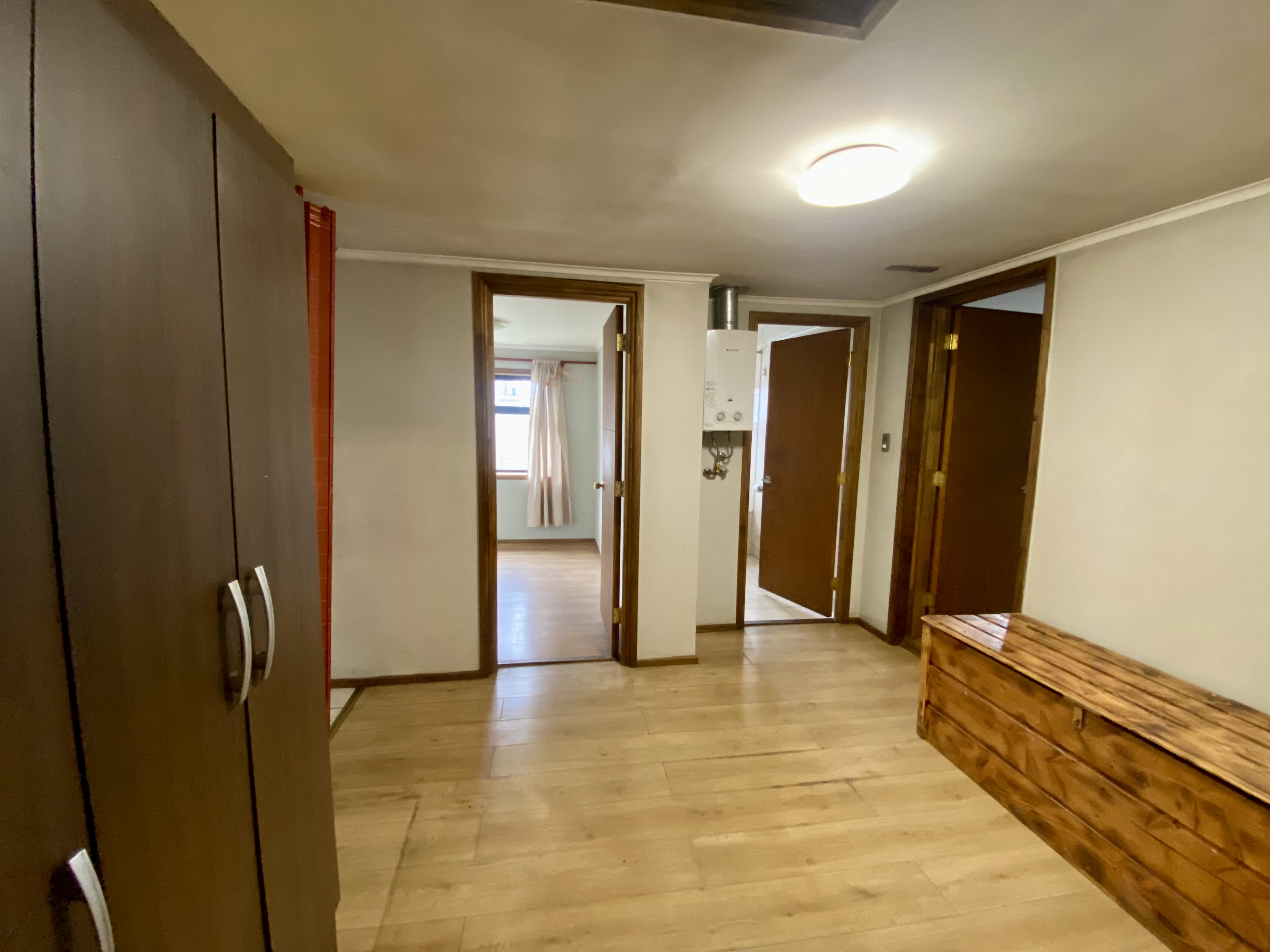 Exterior view of the house with a focus on the entrance and landscaping.