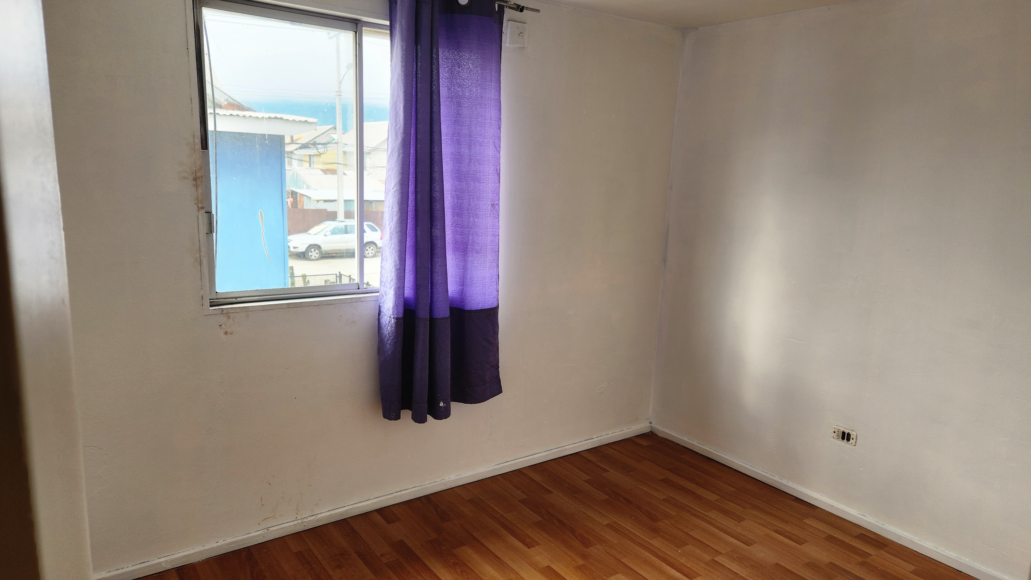 View of the house from the street showing the neighborhood.