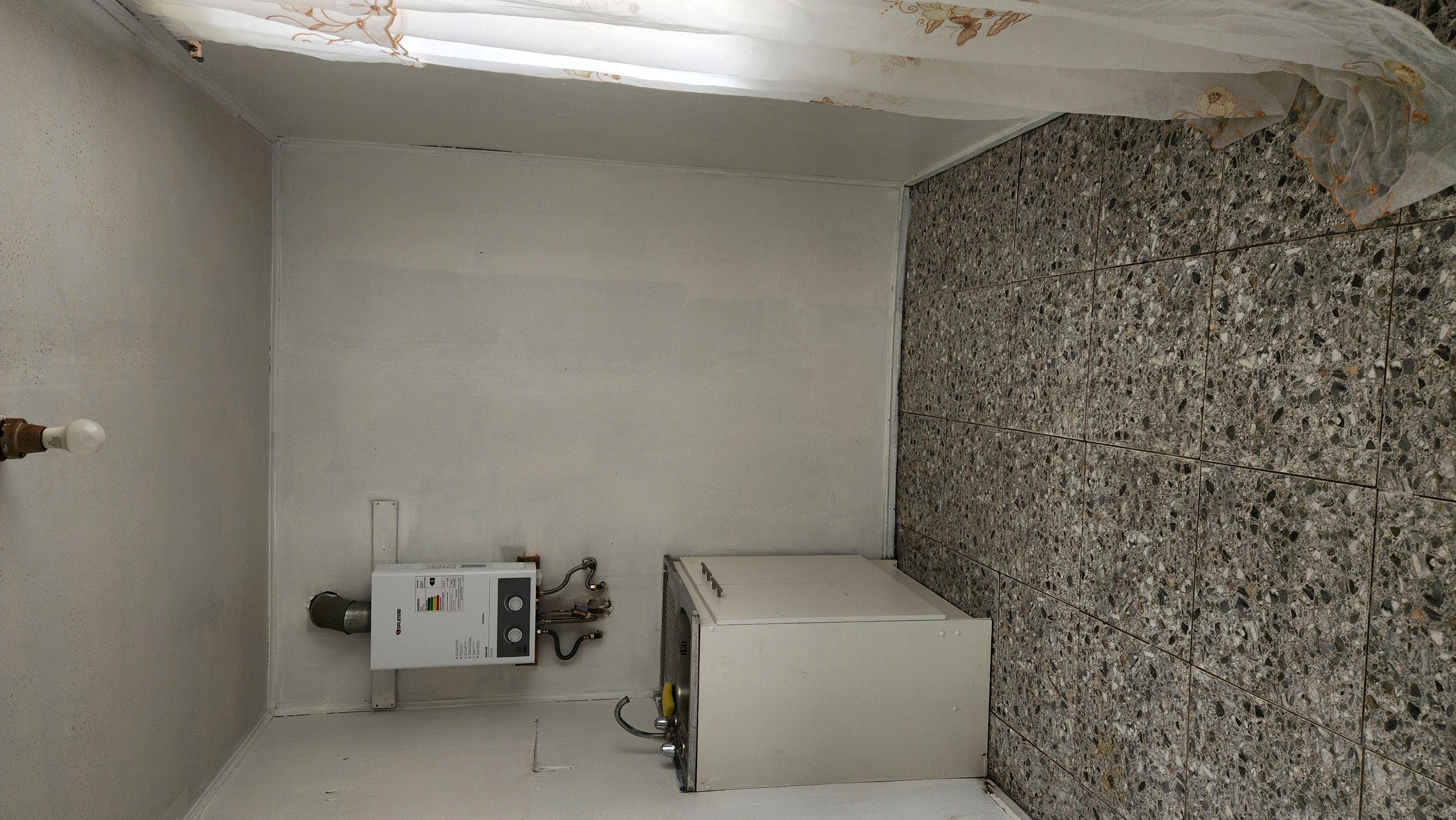 Another angle of the house showcasing the roof and chimney.