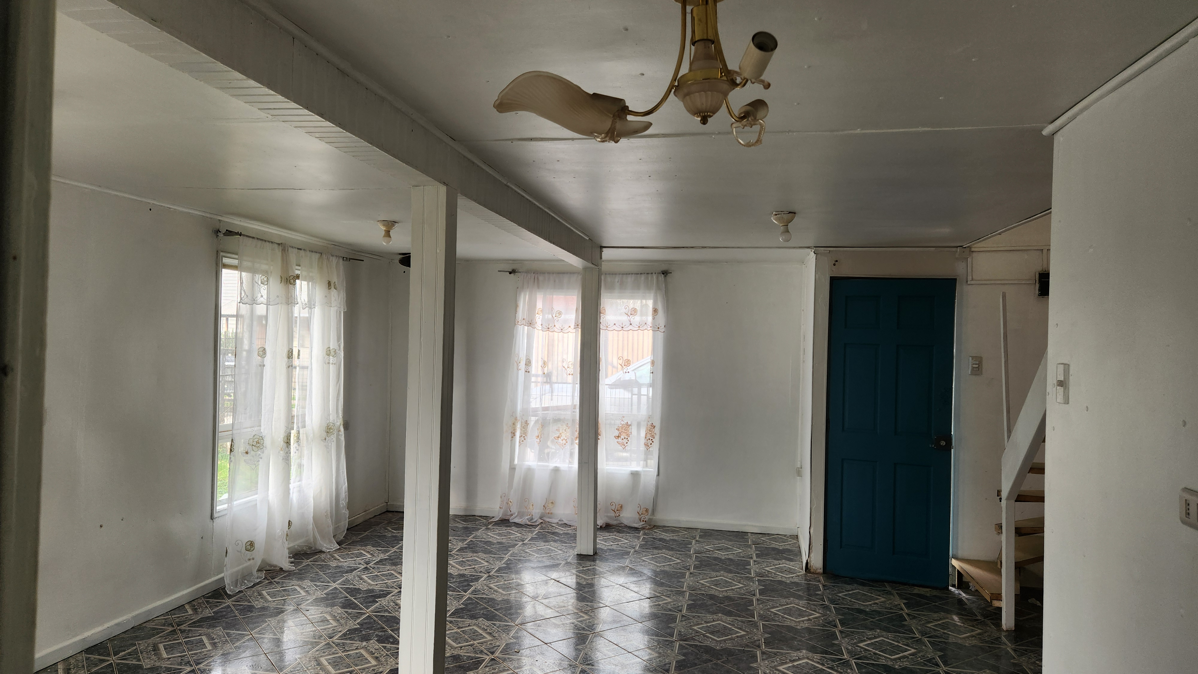 Close-up of the house's entrance and front garden area.