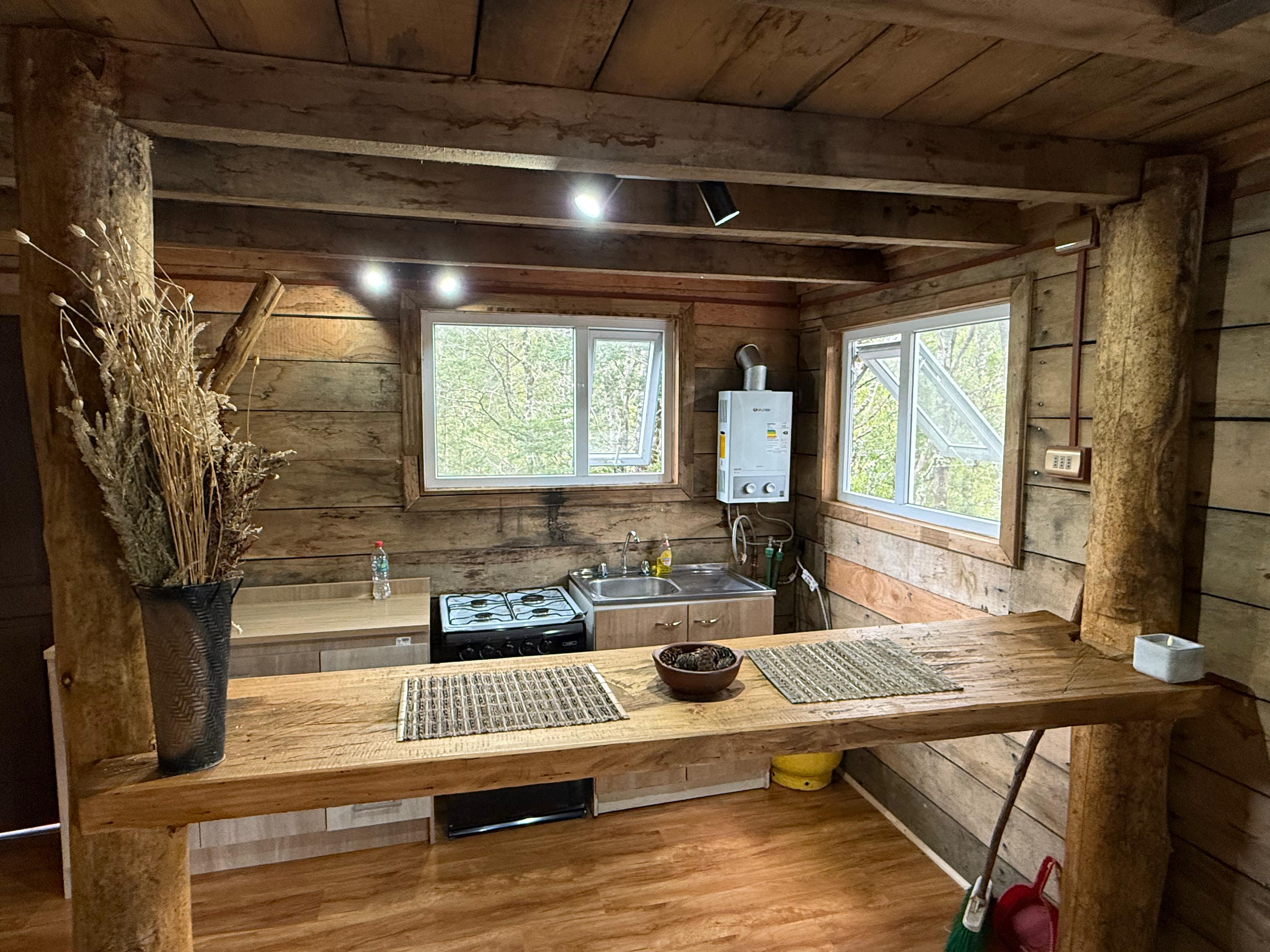 The cabin and land parcel with a clear blue sky