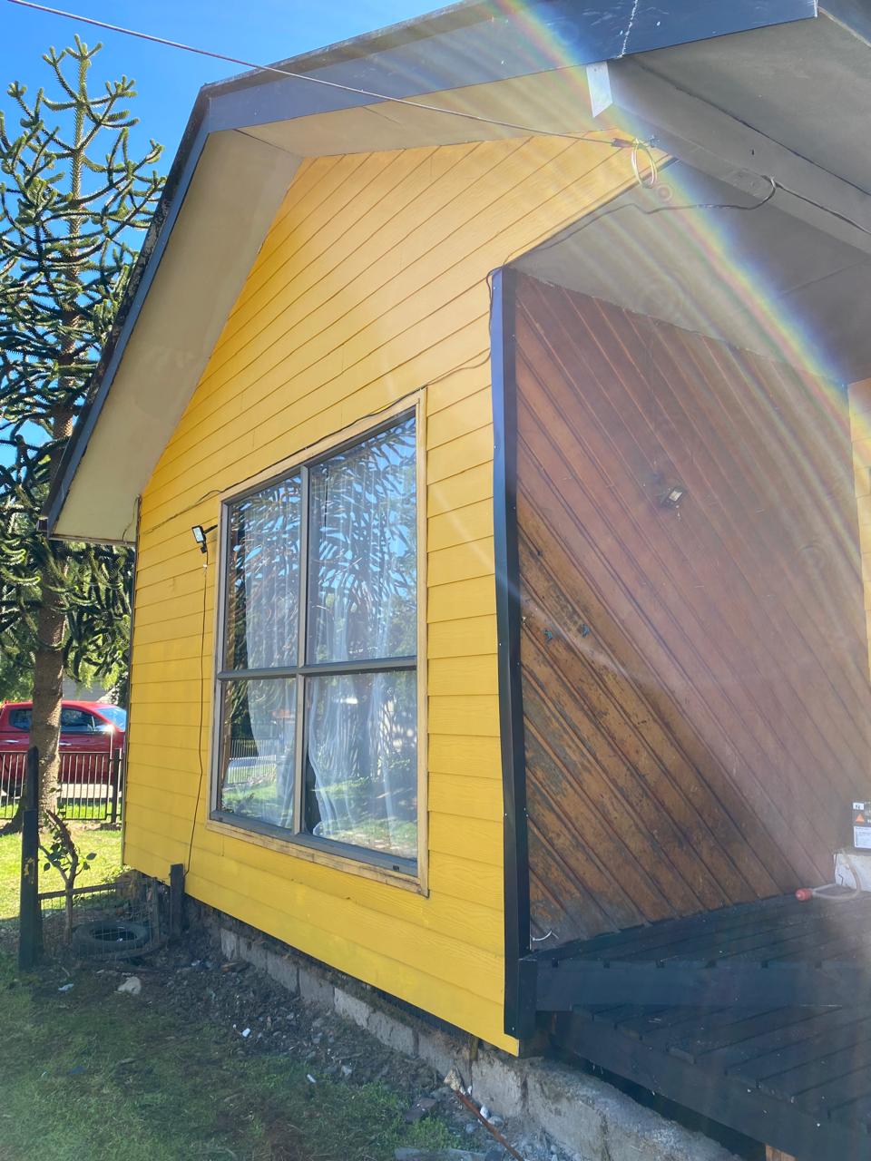 Front yard with grass and trees in Puerto Aysen